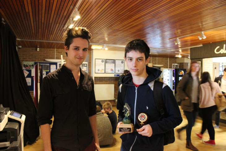 Winner, Owain Davies, receives his trophy from Alaric Stephen