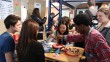 students practice using chop sticks and get a taste of flour-free Chinese cake on the Mandarin stand.